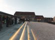 barn wedding reception guests enjoy drinks on terrace